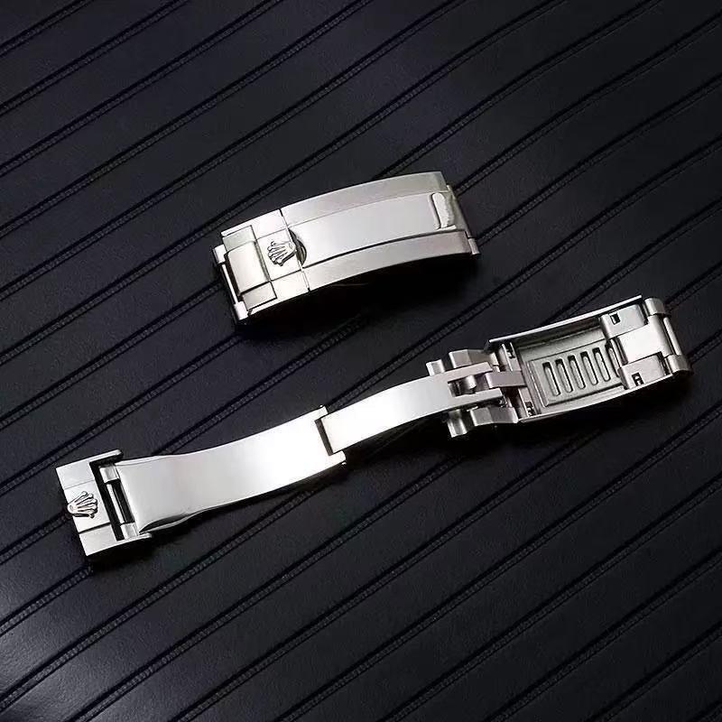 Rolex-compatible crown-logo clasp shown closed and opened to reveal the extension mechanism